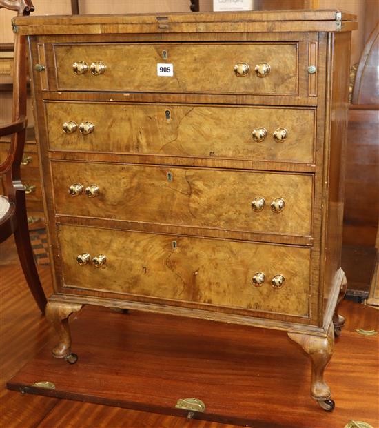 A reproduction walnut bachelors chest W.64cm